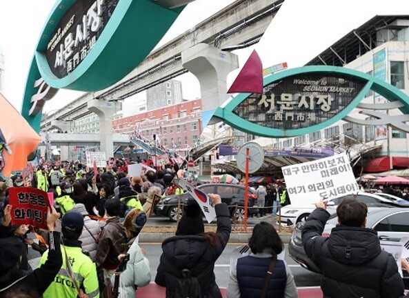27일 한동훈 전 대표가 대구서문시장을 방문한 가운데 지지자들과 반대파가 각각 구호를 외치고 있다. 사진=남경원 기자